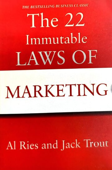 The 22 Immutable Laws Of Marketing by Al Ries And Jack Trout (English) (Paperback).